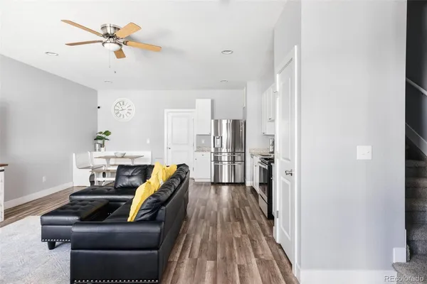 a living room with furniture and a rug