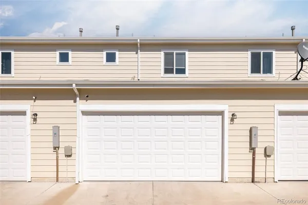 a front view of a house with a garage