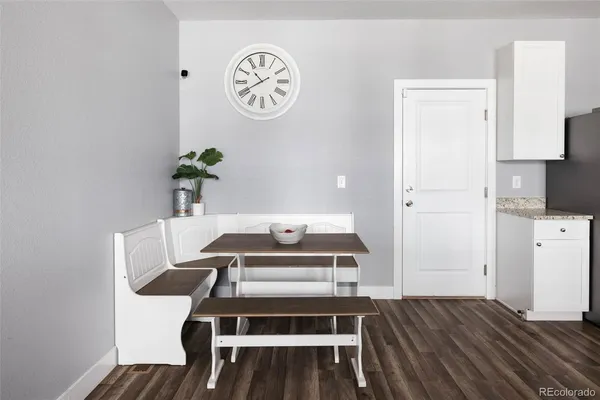a view of kitchen and wooden floor
