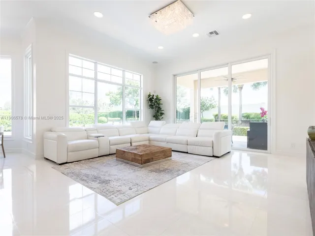 a kitchen with kitchen island a white counter top space and appliances