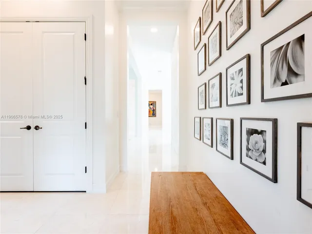 a view of a livingroom with wooden floor and furniture