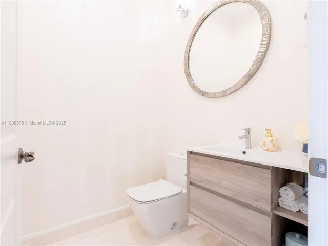 a bedroom with a bed and a table in it