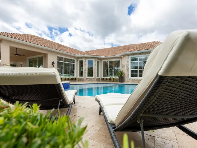 a view of a garden with large trees