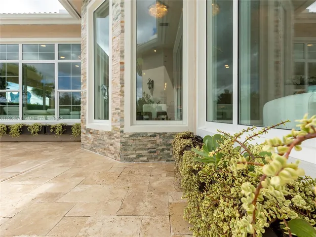 a view of swimming pool with a patio