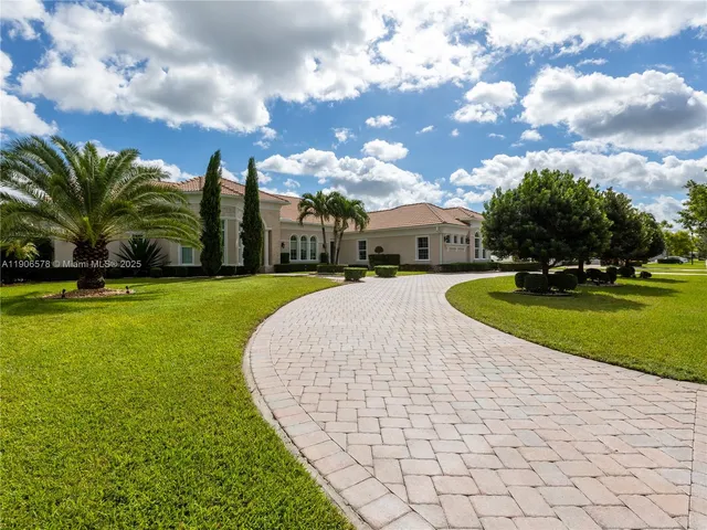a view of a swimming pool and front of house