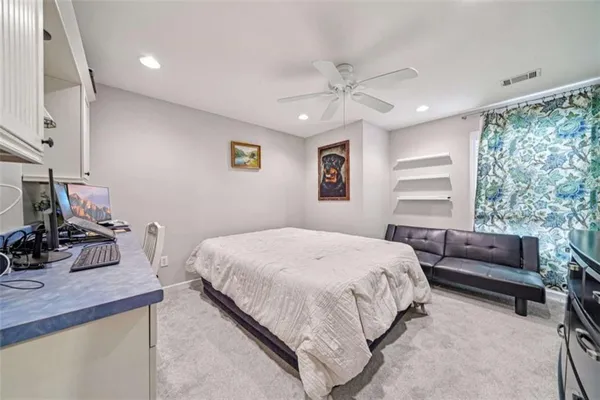 a bed room with a bed and a chandelier