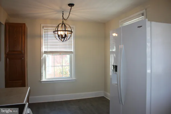 a room with window and a chandelier