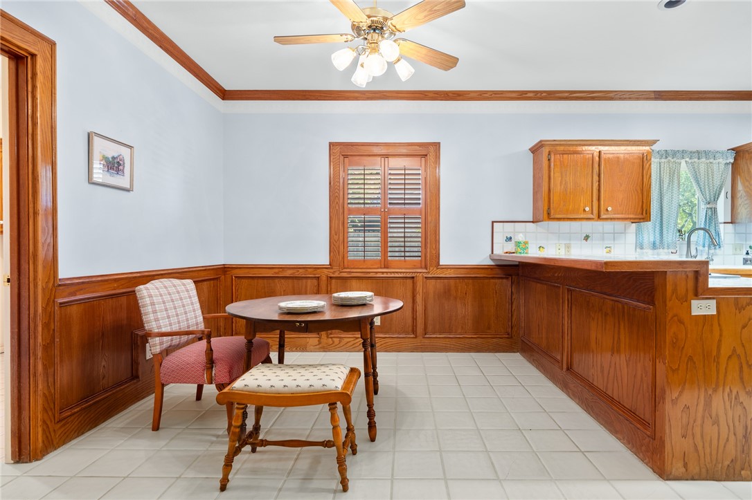 620 Colonial Drive Portland, TX 78374 - Photo 14 of 40 a kitchen with a sink a chair and a window