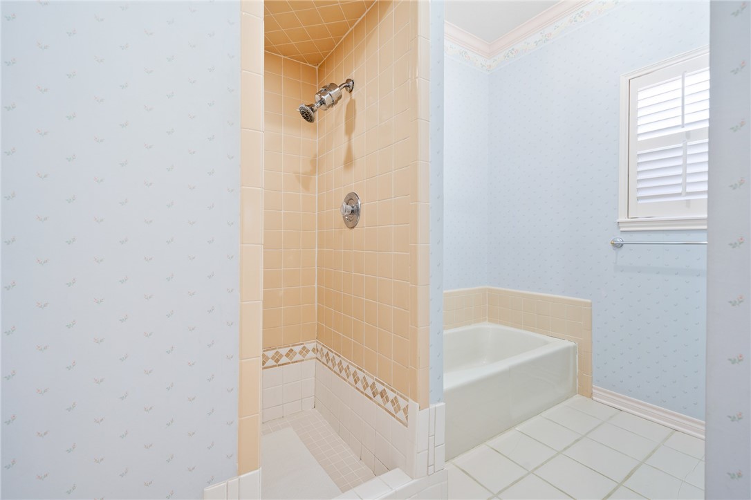 620 Colonial Drive Portland, TX 78374 - Photo 18 of 40 a bathroom with a bathtub and a shower