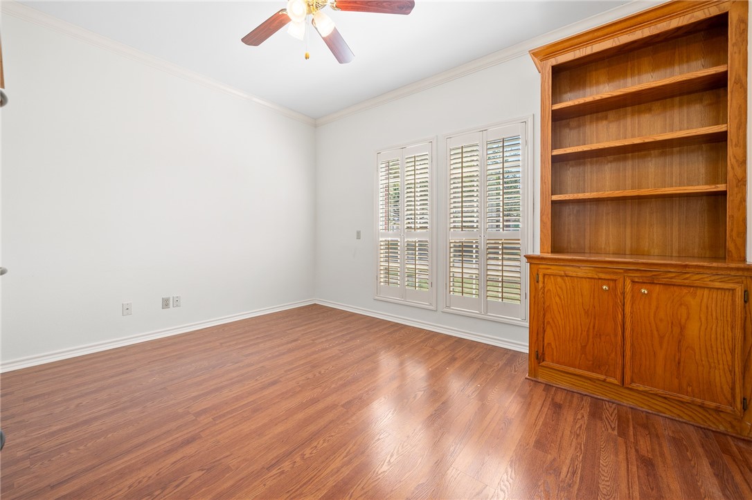 620 Colonial Drive Portland, TX 78374 - Photo 19 of 40 an empty room with wooden floor closet and windows
