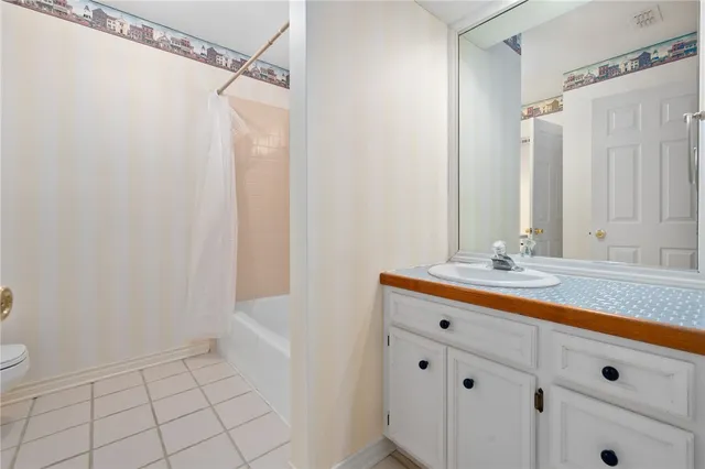 a bathroom with a sink a vanity and a mirror