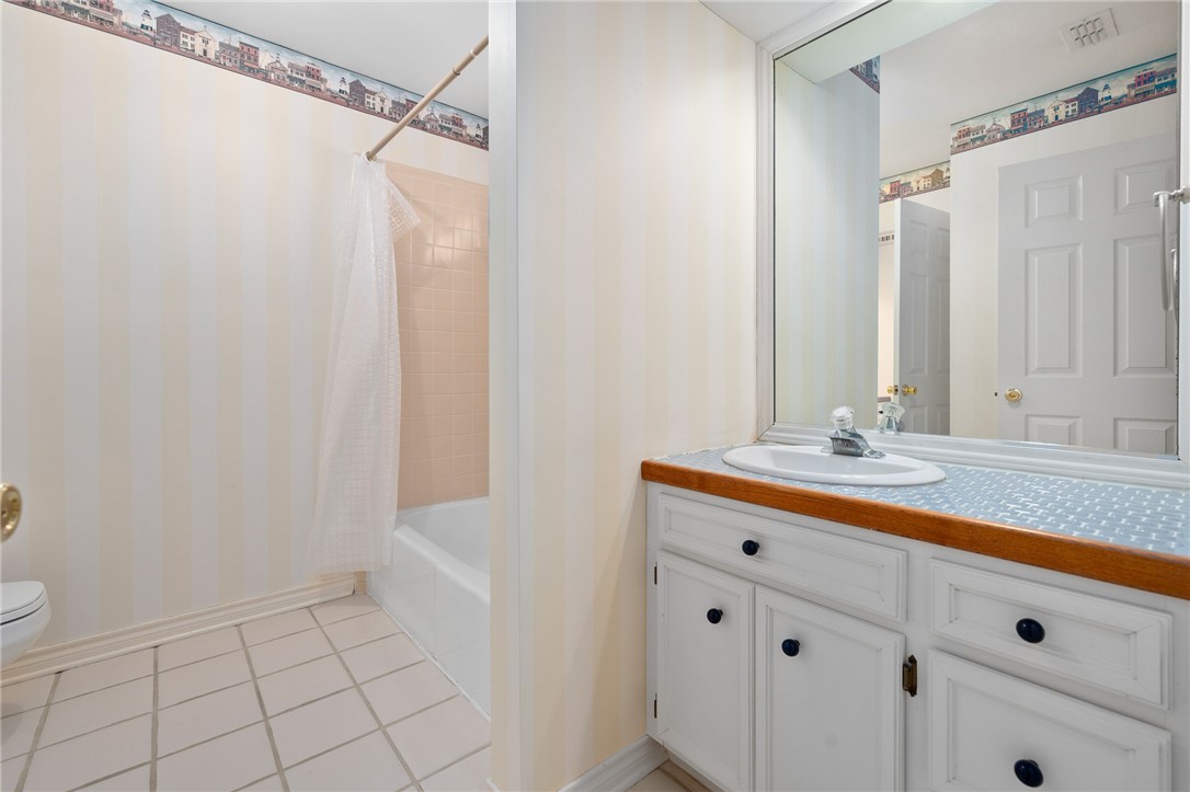 620 Colonial Drive Portland, TX 78374 - Photo 27 of 40 a bathroom with a sink a vanity and a mirror