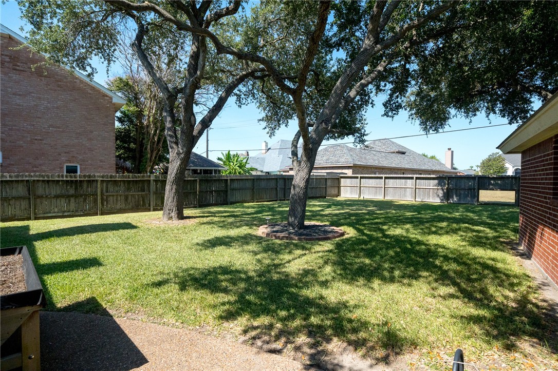 620 Colonial Drive Portland, TX 78374 - Photo 31 of 40 a view of a house with backyard and a tree