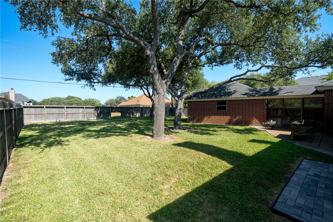 620 Colonial Drive Portland, TX 78374 - Photo 32 of 40 a front view of a house with a yard and garage