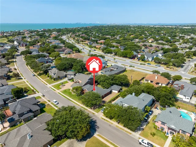 an aerial view of residential houses with outdoor space