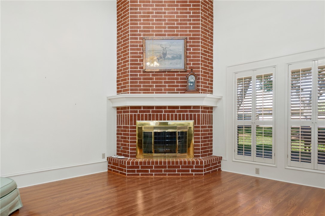 620 Colonial Drive Portland, TX 78374 - Photo 6 of 40 a view of an empty room with wooden floor and a fireplace