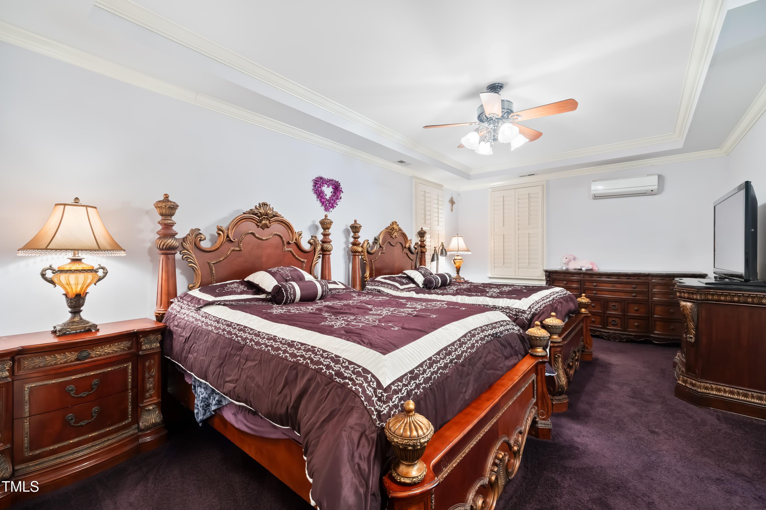 119 Cardinal Crest Pittsboro, NC 27312 - Photo 43 of 70 a bedroom with a bed and a chandelier