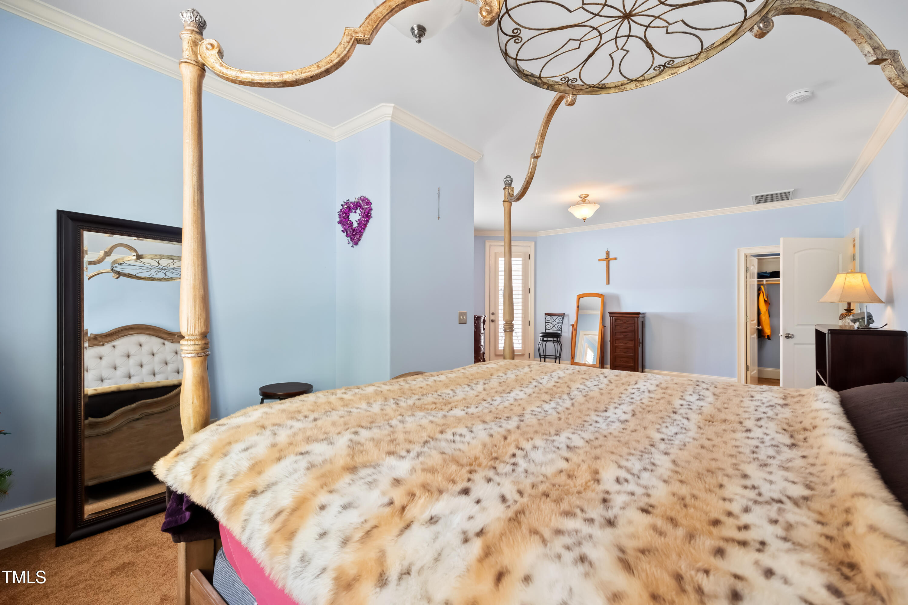 119 Cardinal Crest Pittsboro, NC 27312 - Photo 49 of 70 a bed room with a bed mirror and a chandelier