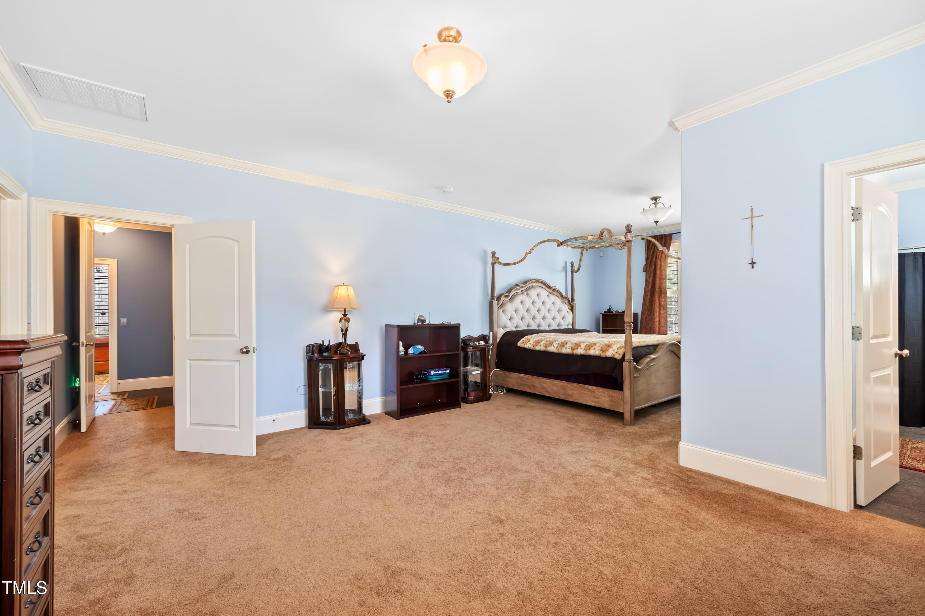 119 Cardinal Crest Pittsboro, NC 27312 - Photo 51 of 70 a bedroom with furniture and a chandelier