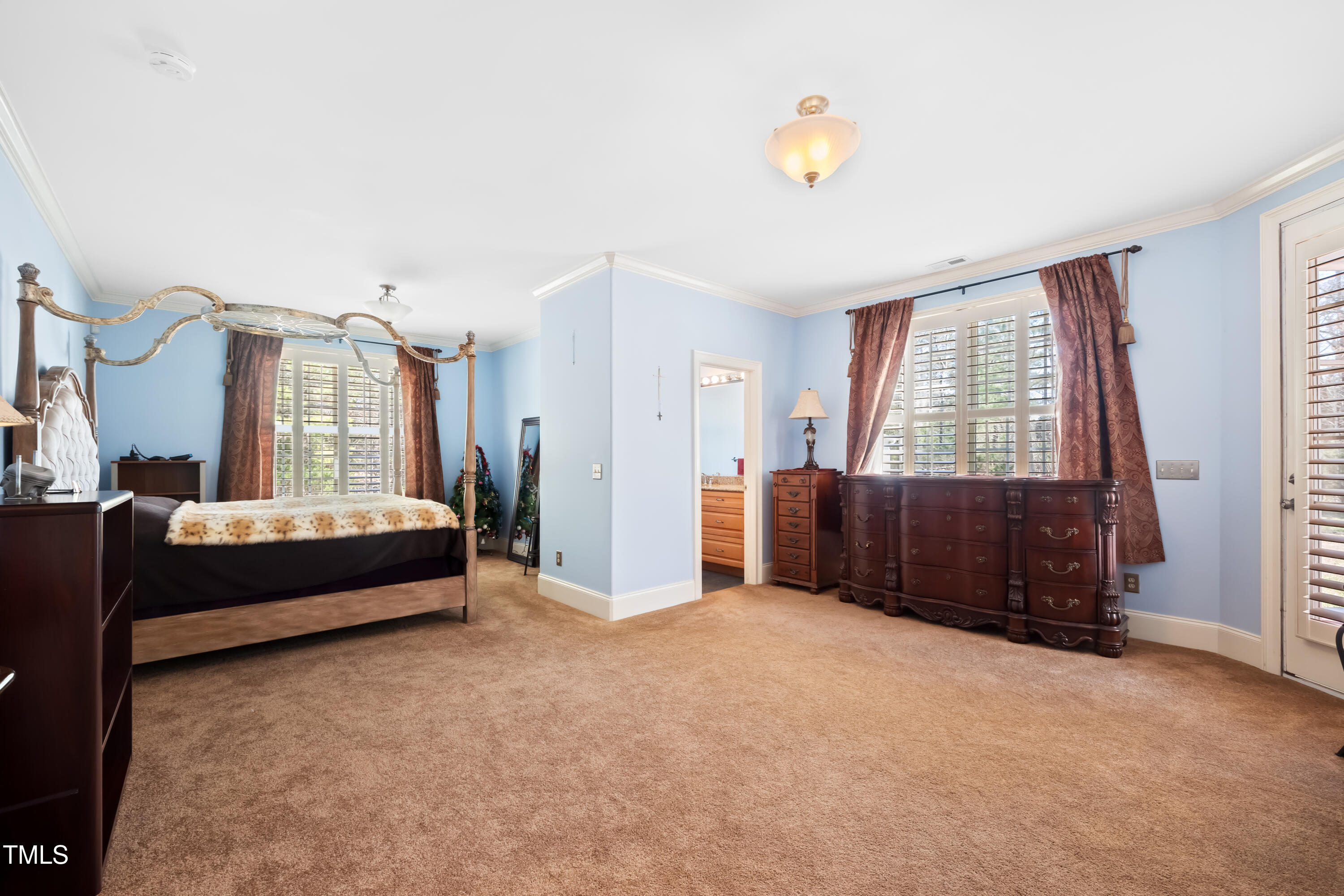 119 Cardinal Crest Pittsboro, NC 27312 - Photo 52 of 70 a spacious bedroom with a bed and a window