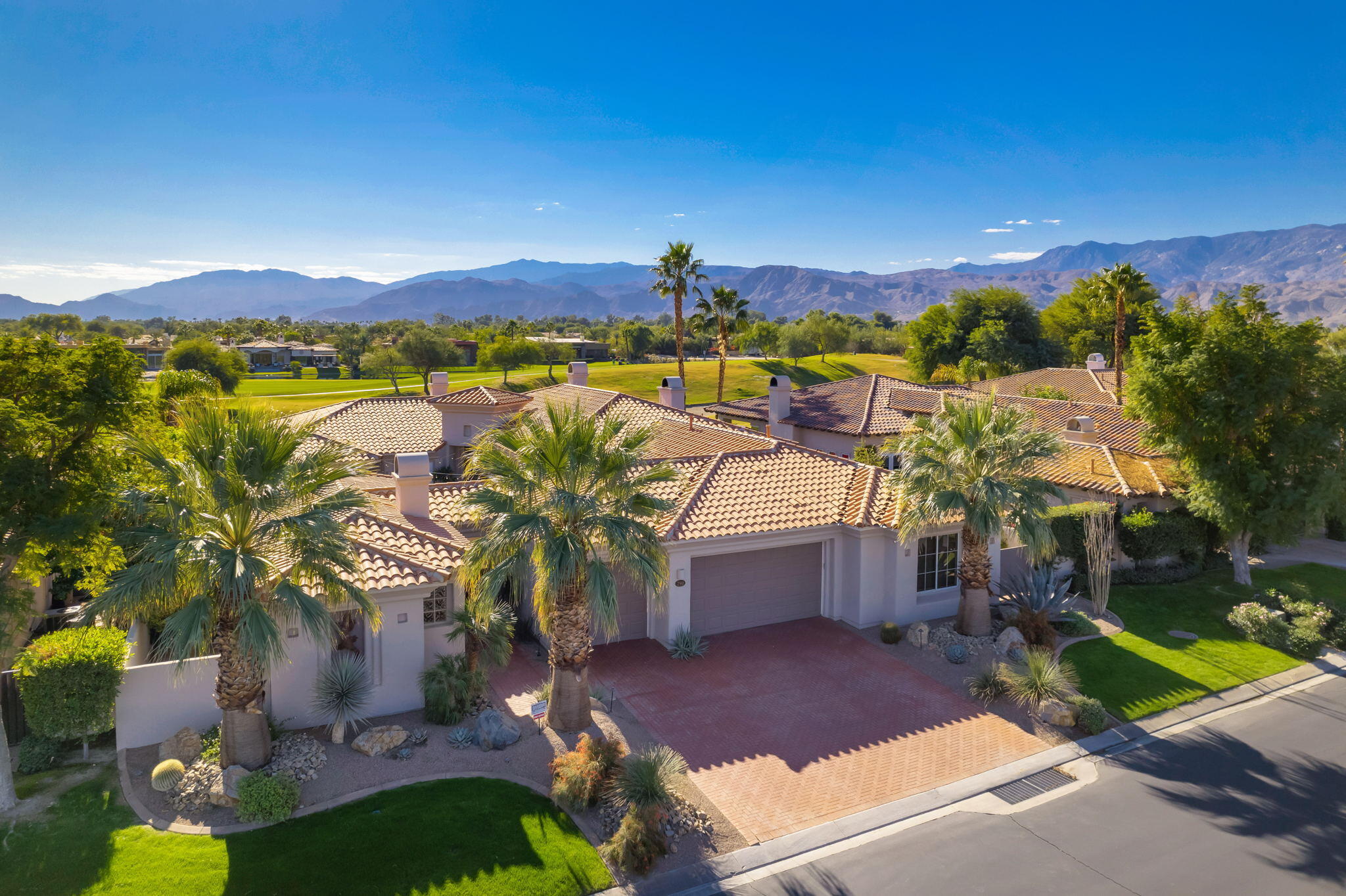290 Loch Lomond Road Rancho Mirage, CA 92270 - Photo 1 of 50 a view of swimming pool with a table and chairs