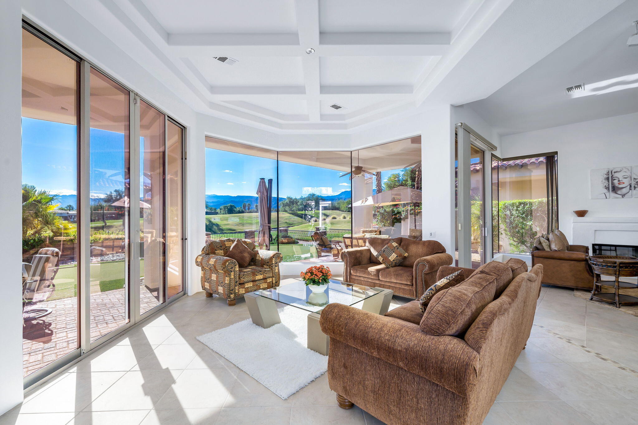 290 Loch Lomond Road Rancho Mirage, CA 92270 - Photo 11 of 50 a living room with furniture ceiling fan and a large window