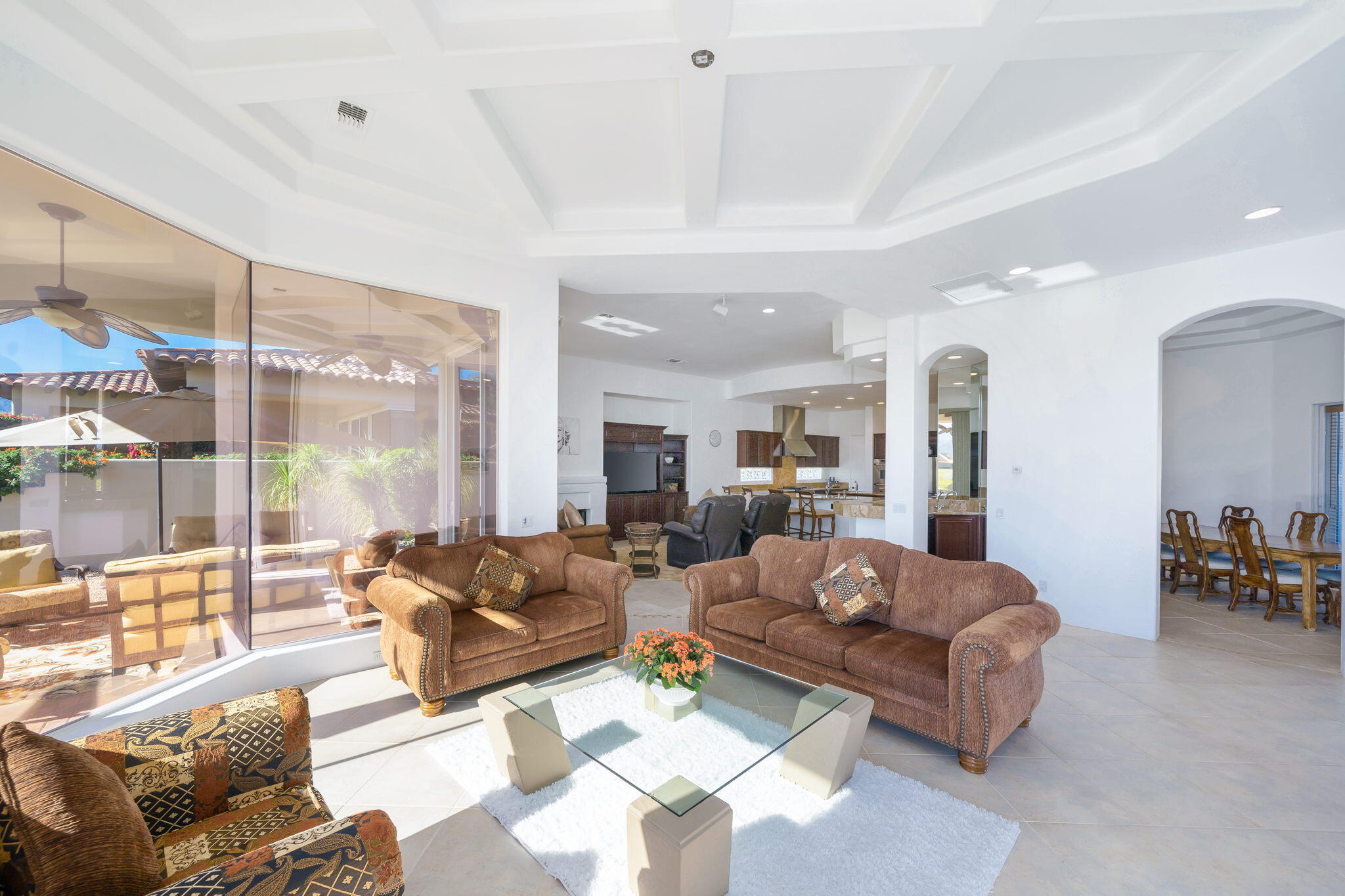 290 Loch Lomond Road Rancho Mirage, CA 92270 - Photo 13 of 50 a living room with furniture ceiling fan and a large window