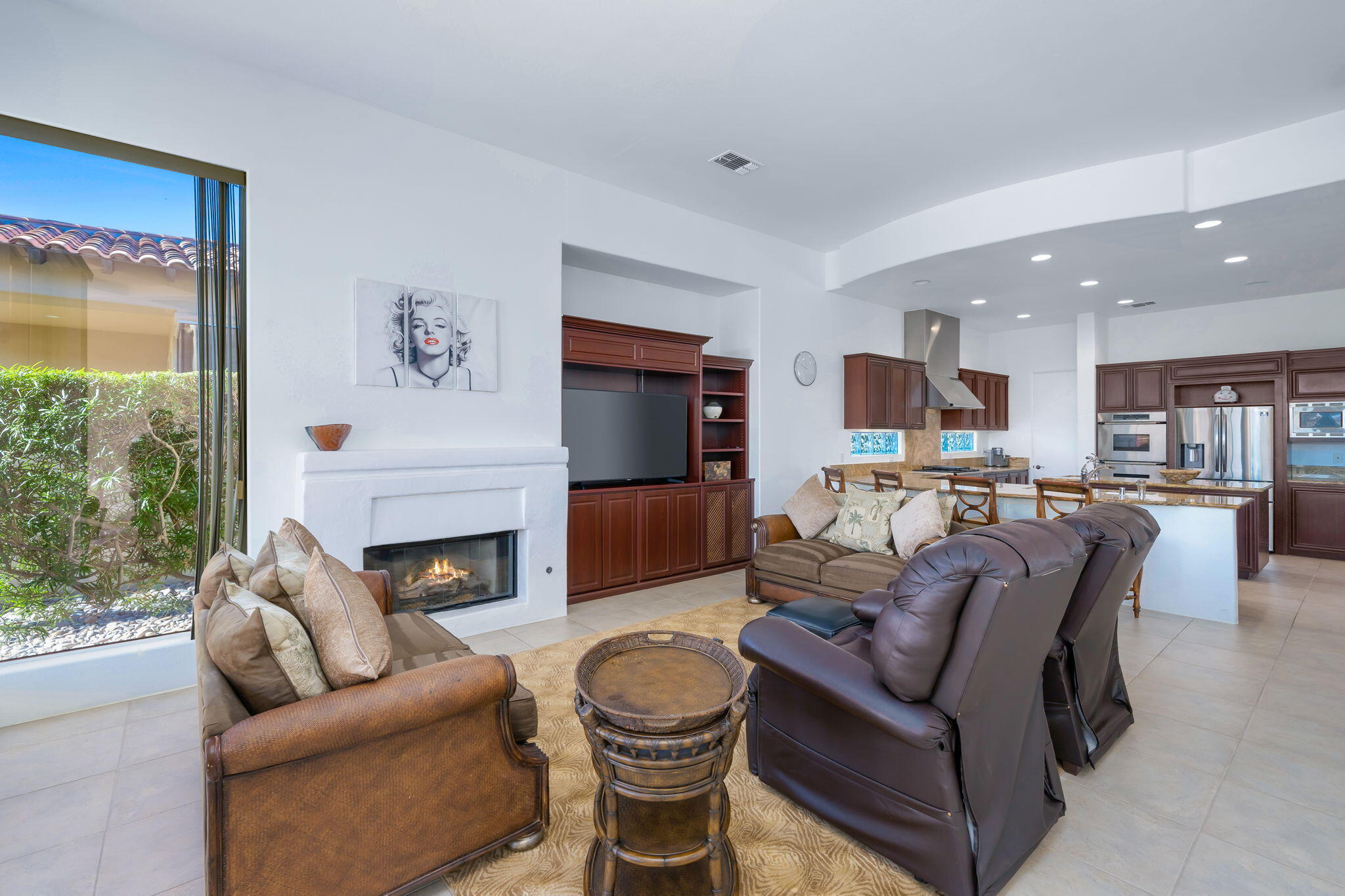 290 Loch Lomond Road Rancho Mirage, CA 92270 - Photo 14 of 50 a living room with furniture and a fireplace