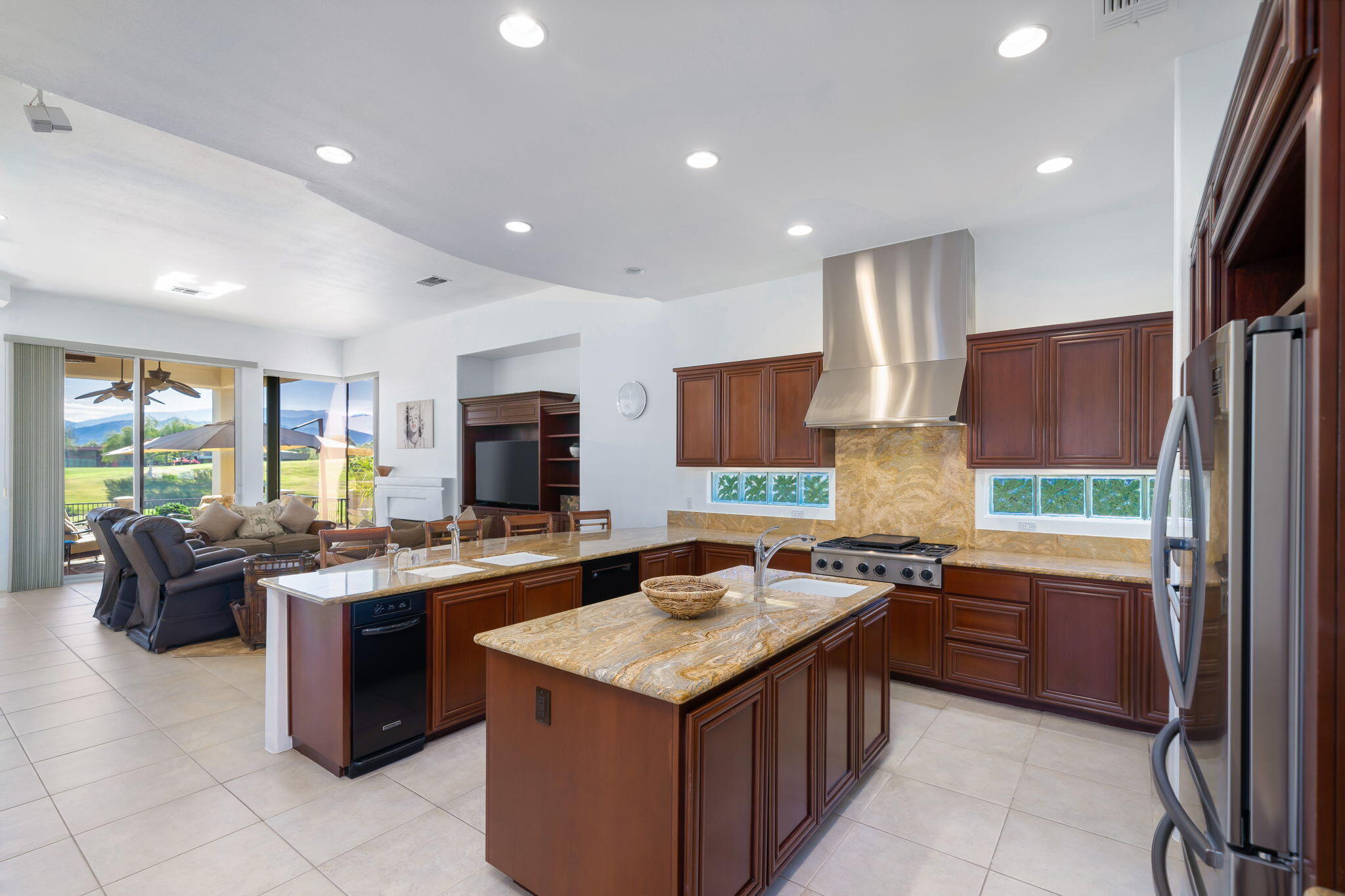 290 Loch Lomond Road Rancho Mirage, CA 92270 - Photo 16 of 50 a kitchen with a stove sink and a refrigerator