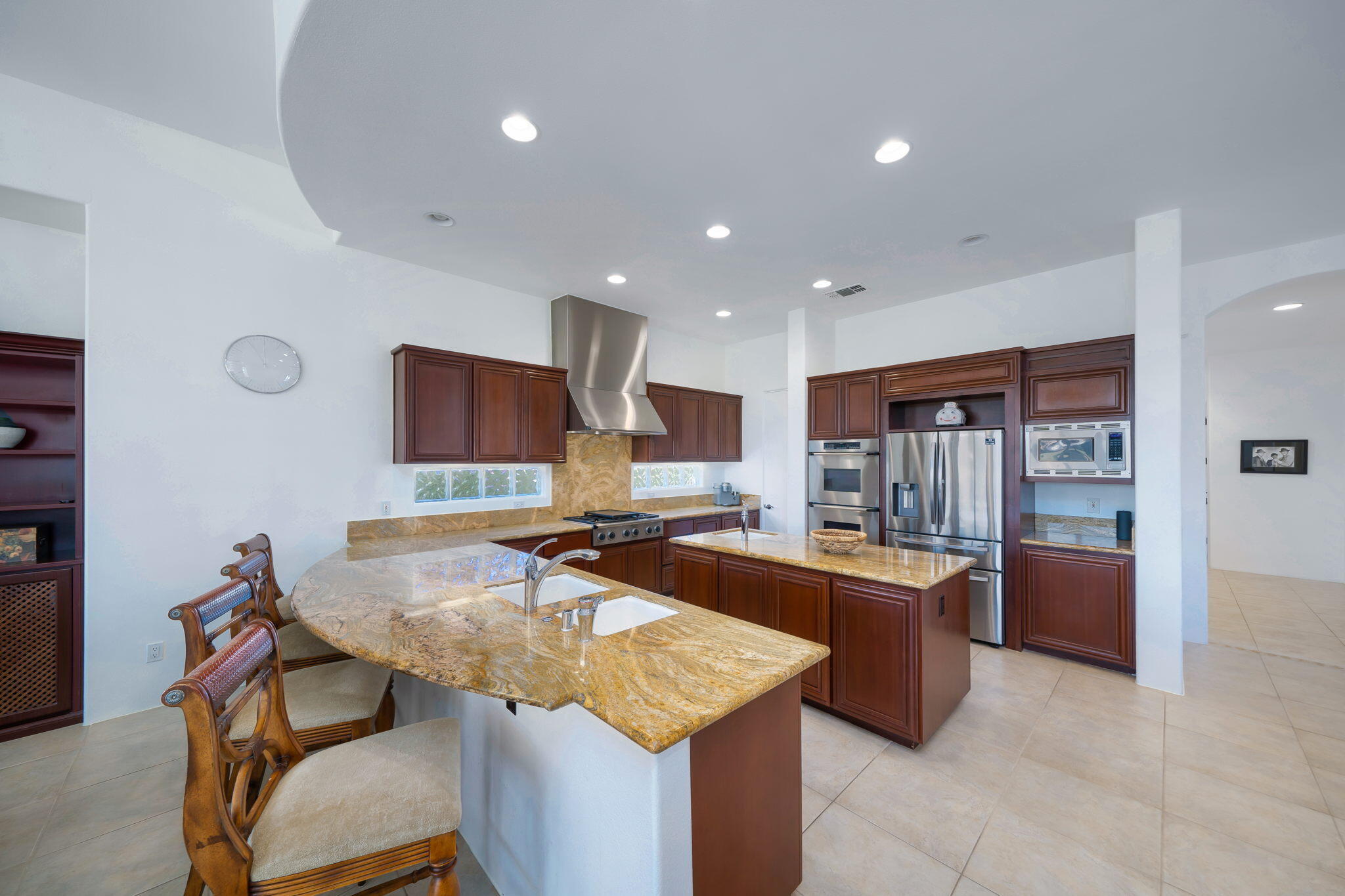 290 Loch Lomond Road Rancho Mirage, CA 92270 - Photo 18 of 50 a kitchen with stainless steel appliances granite countertop sink stove and refrigerator