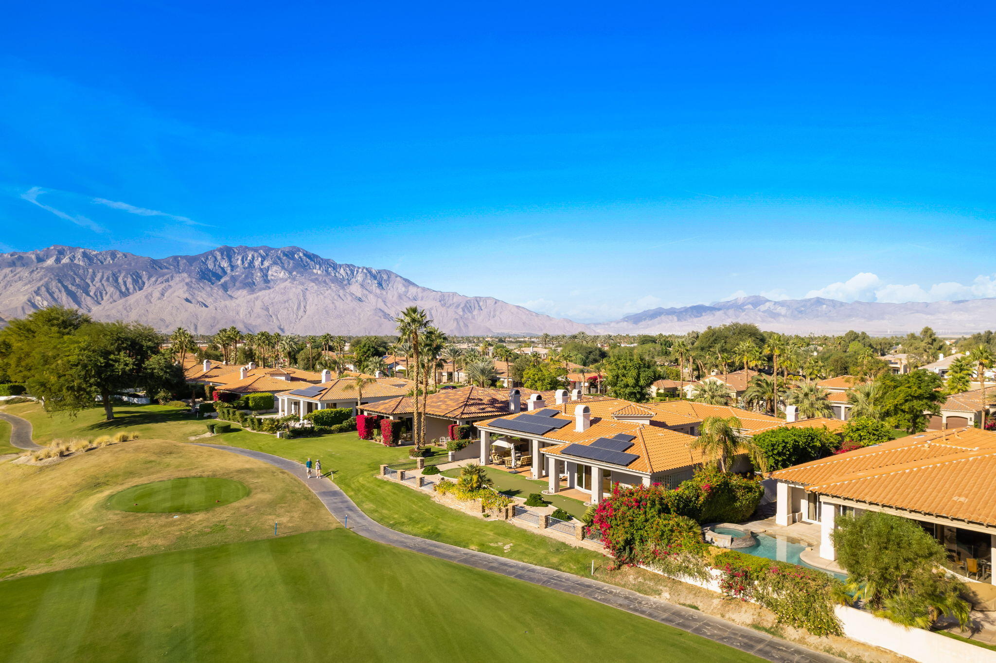 290 Loch Lomond Road Rancho Mirage, CA 92270 - Photo 3 of 50 a view of a lake with a mountain in the background