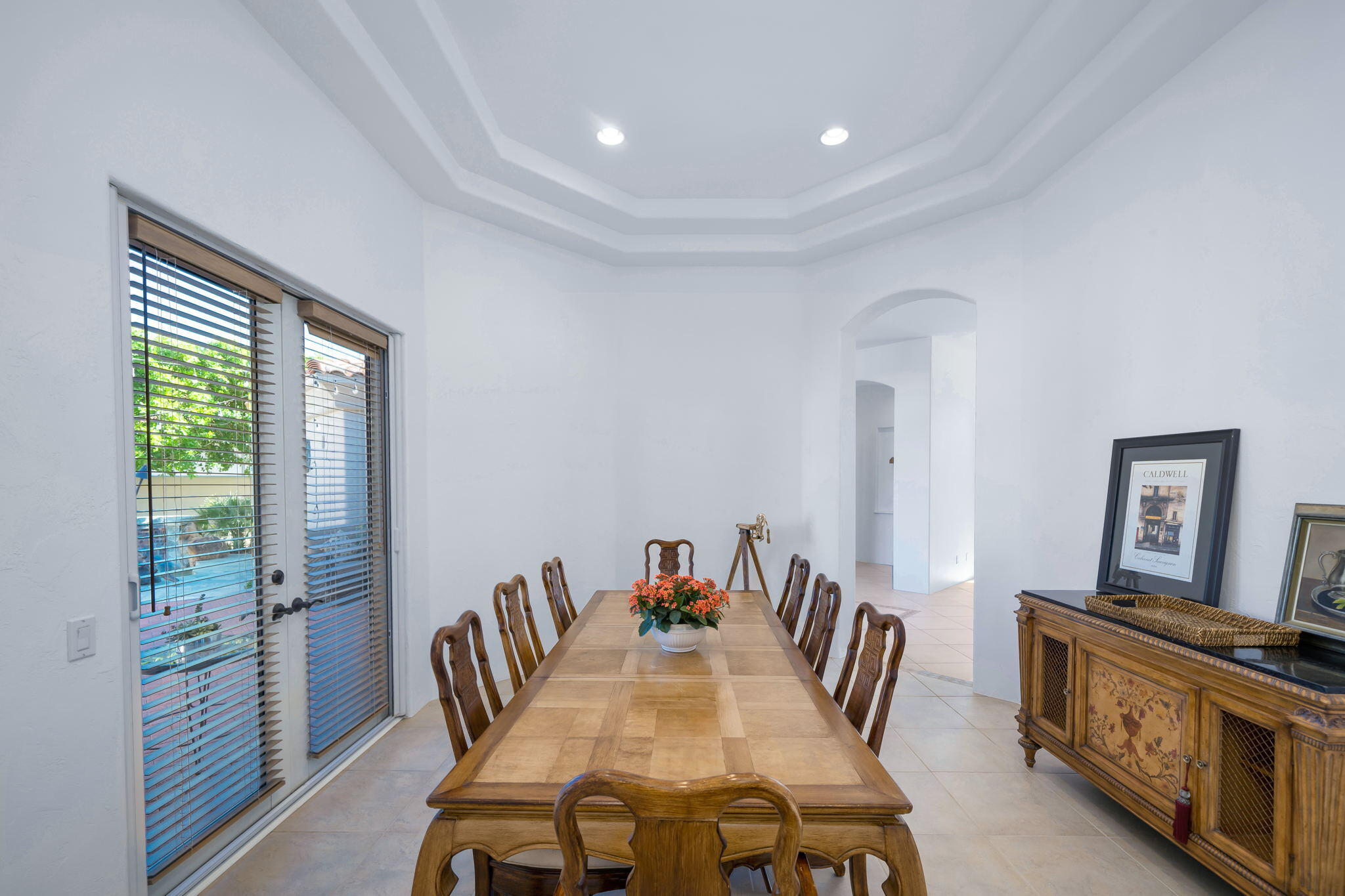 290 Loch Lomond Road Rancho Mirage, CA 92270 - Photo 21 of 50 a view of a dining room with furniture window and wooden floor