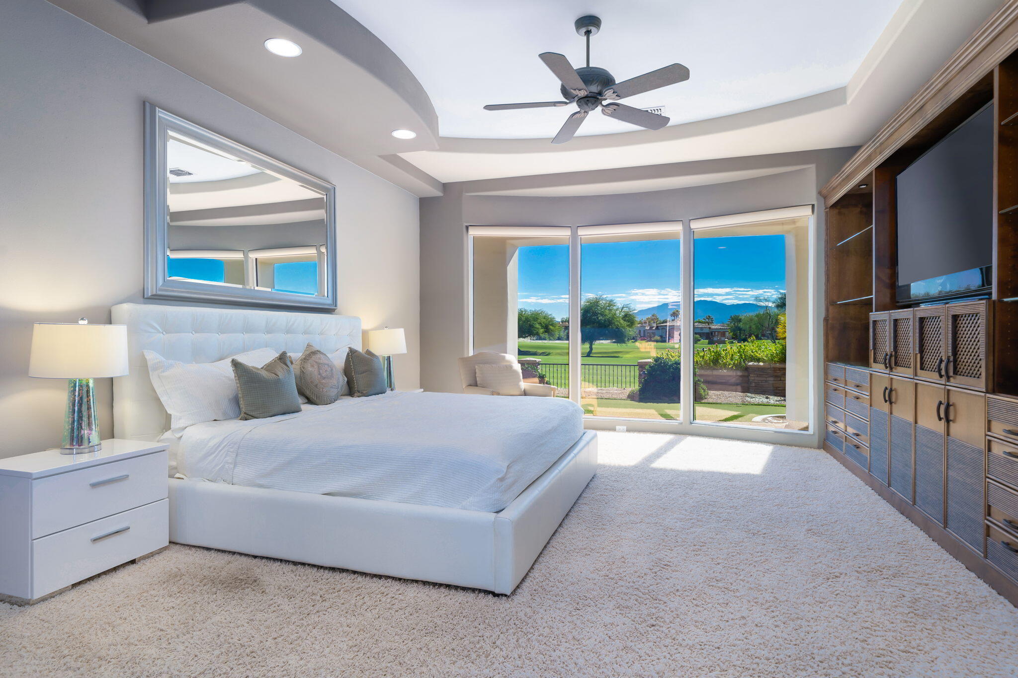 290 Loch Lomond Road Rancho Mirage, CA 92270 - Photo 23 of 50 a spacious bedroom with a large bed and a large window