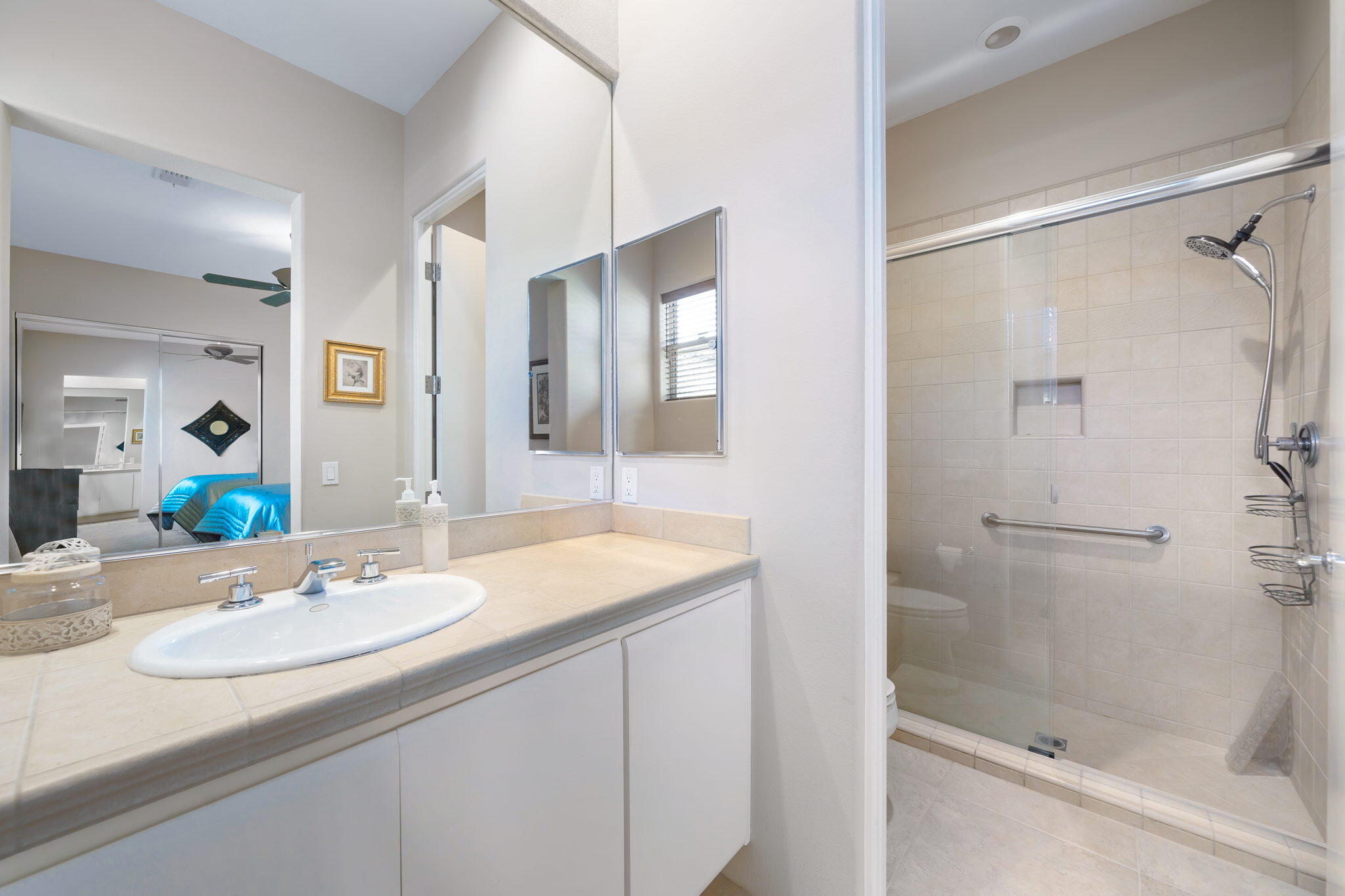 290 Loch Lomond Road Rancho Mirage, CA 92270 - Photo 29 of 50 a bathroom with a sink and a mirror