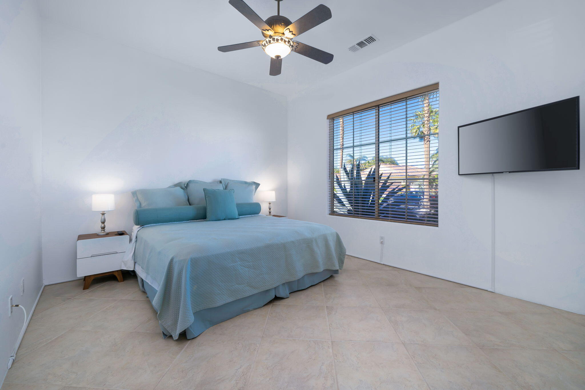290 Loch Lomond Road Rancho Mirage, CA 92270 - Photo 30 of 50 a bedroom with a bed and a flat screen tv