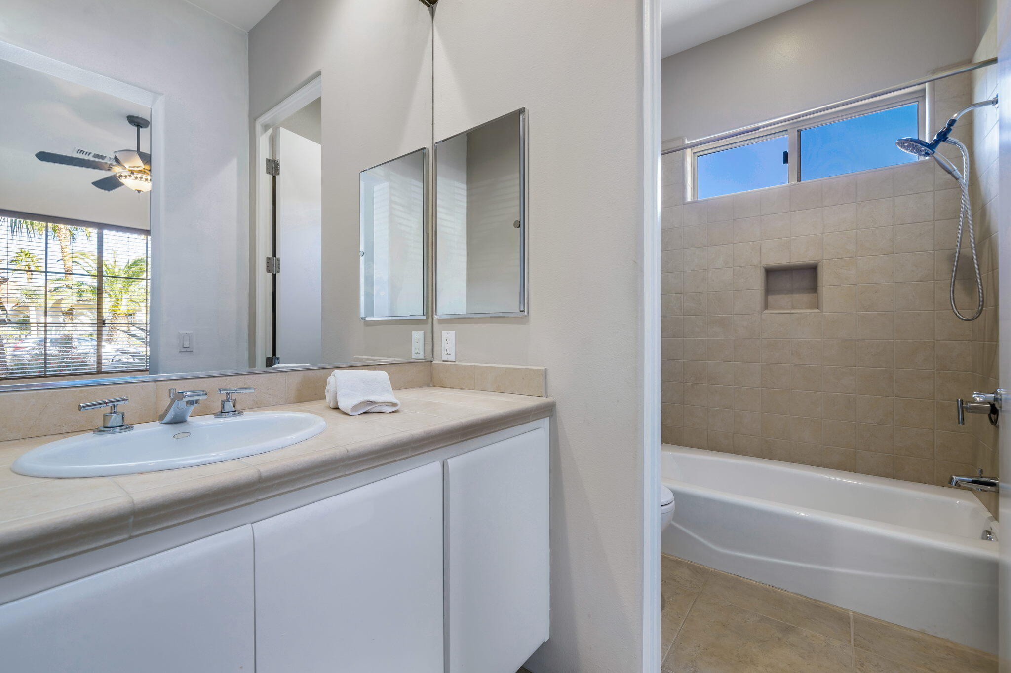 290 Loch Lomond Road Rancho Mirage, CA 92270 - Photo 31 of 50 a bathroom with a granite countertop sink and a mirror