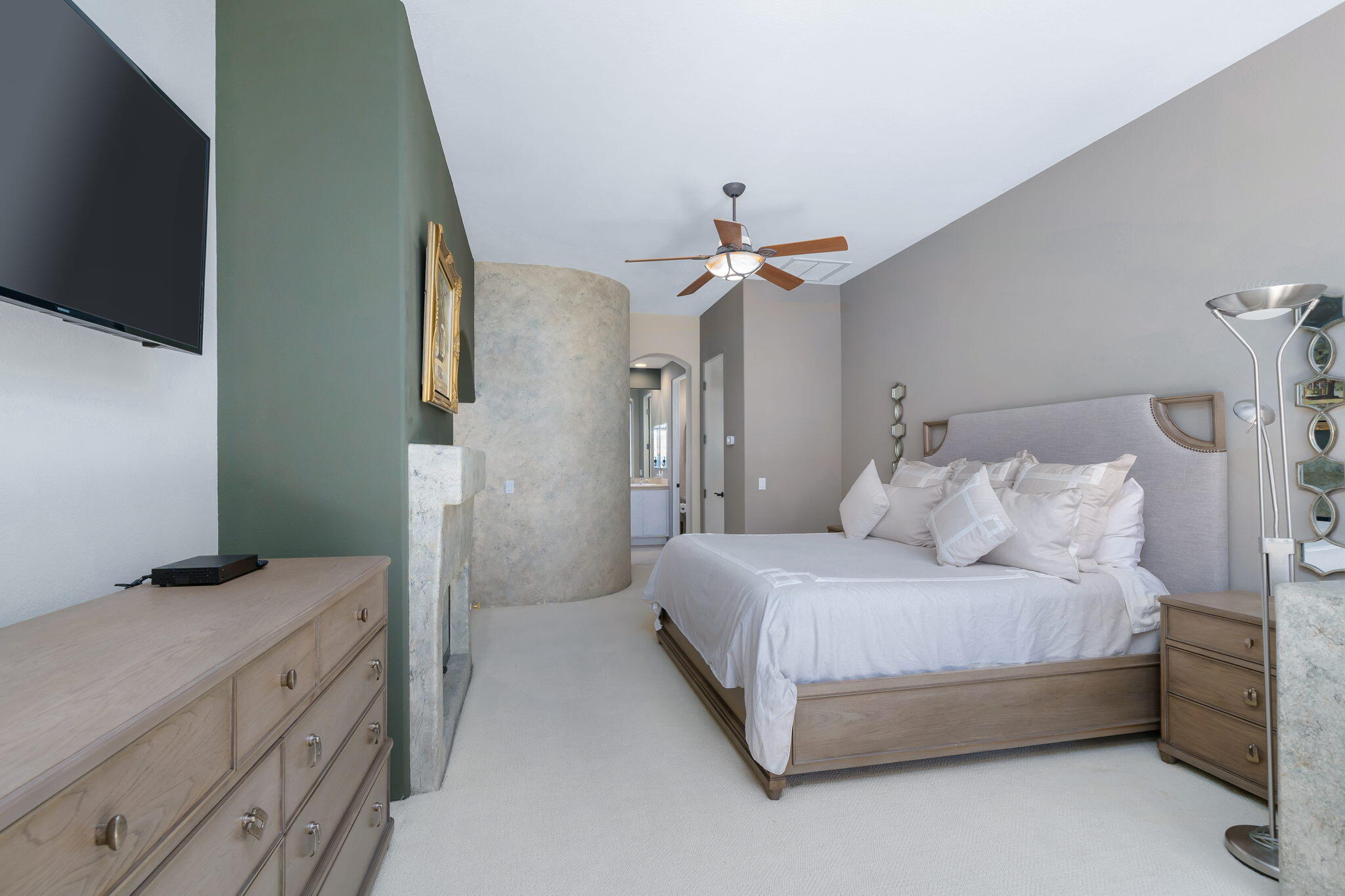 290 Loch Lomond Road Rancho Mirage, CA 92270 - Photo 33 of 50 a spacious bedroom with a bed and a chandelier