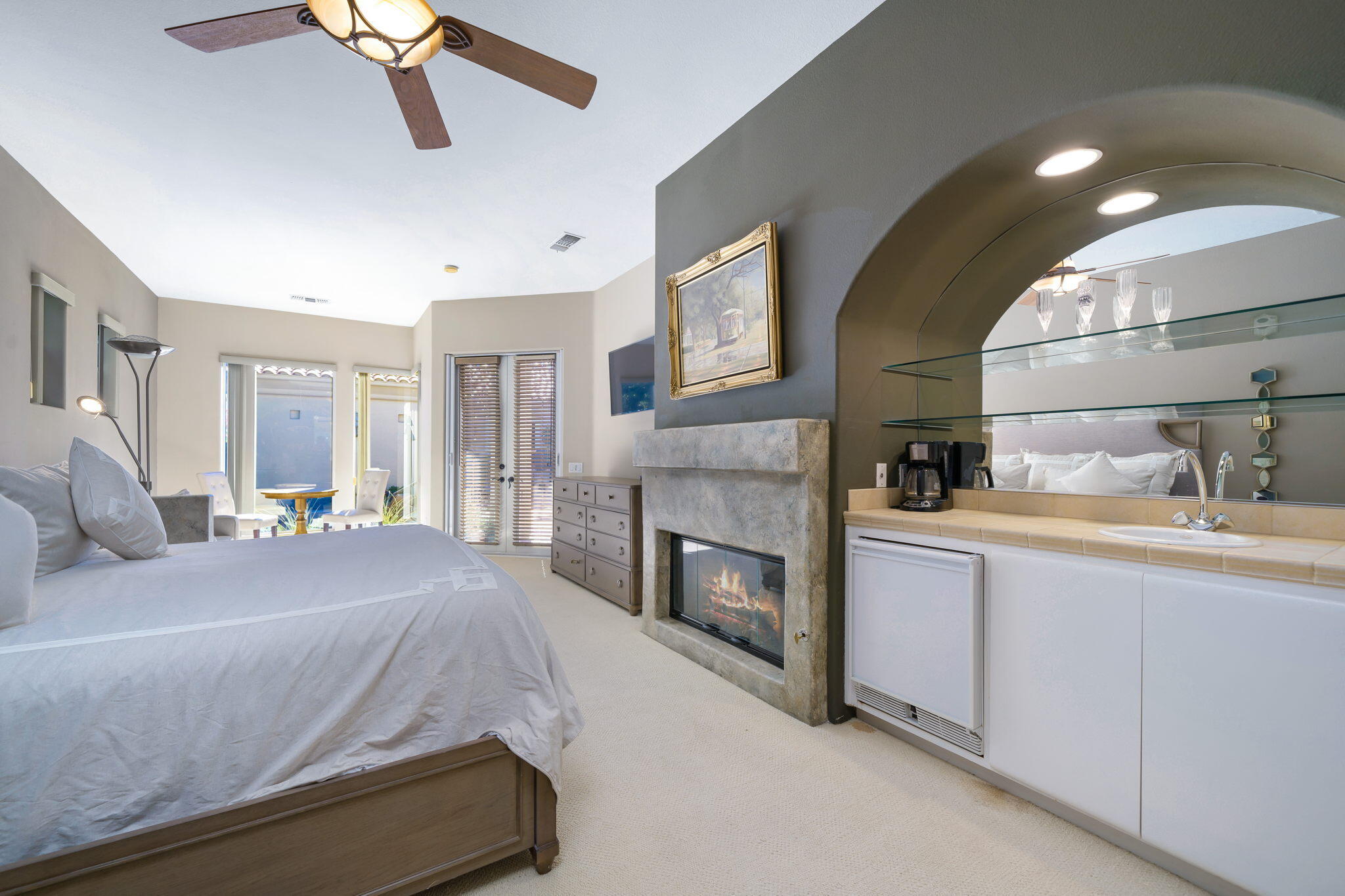 290 Loch Lomond Road Rancho Mirage, CA 92270 - Photo 35 of 50 a spacious bedroom with a bed and fireplace
