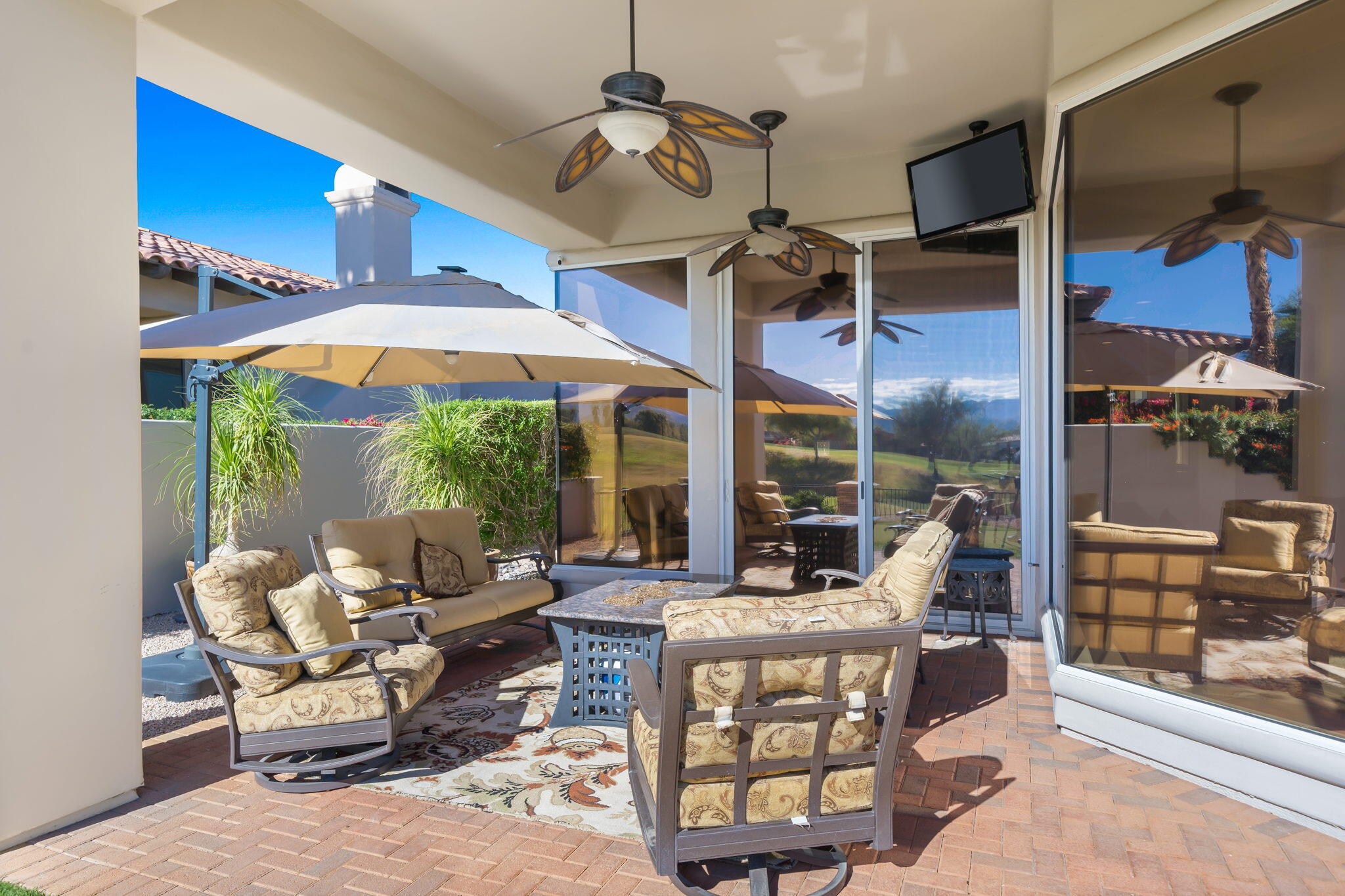 290 Loch Lomond Road Rancho Mirage, CA 92270 - Photo 43 of 50 a living room with patio furniture and a floor to ceiling window