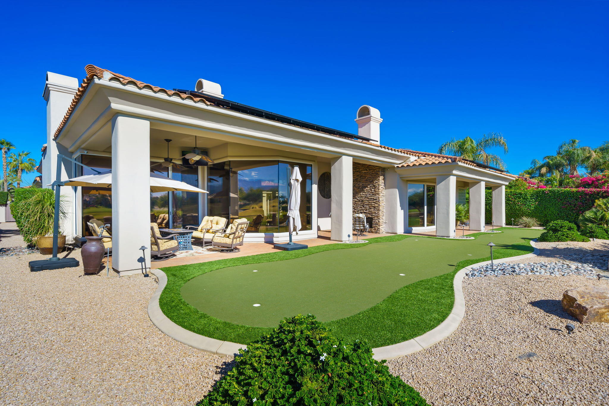 290 Loch Lomond Road Rancho Mirage, CA 92270 - Photo 45 of 50 front view of a house with a yard