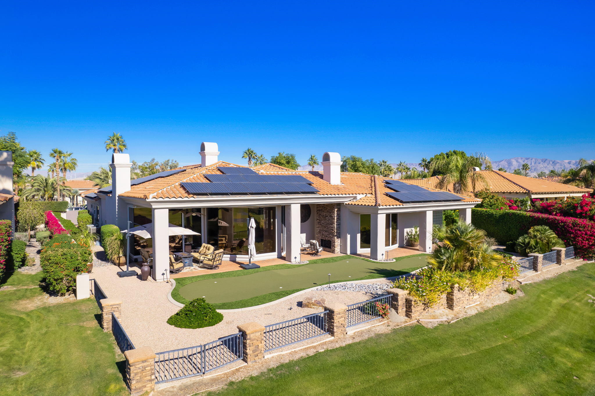 290 Loch Lomond Road Rancho Mirage, CA 92270 - Photo 50 of 50 a view of a house with a yard patio and fire pit