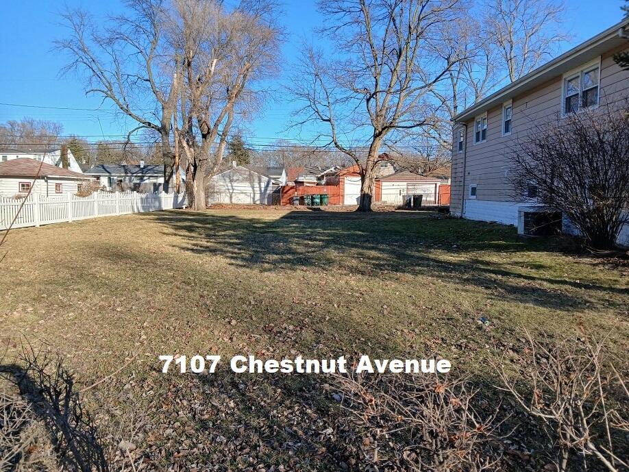 7107 Chestnut Avenue Hammond, IN 46324 - Photo 1 of 5 a view of a yard with a tree