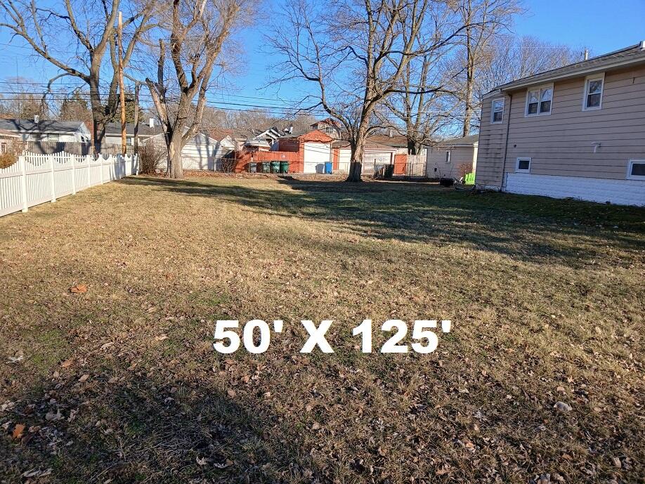7107 Chestnut Avenue Hammond, IN 46324 - Photo 2 of 5 a view of a yard with a tree