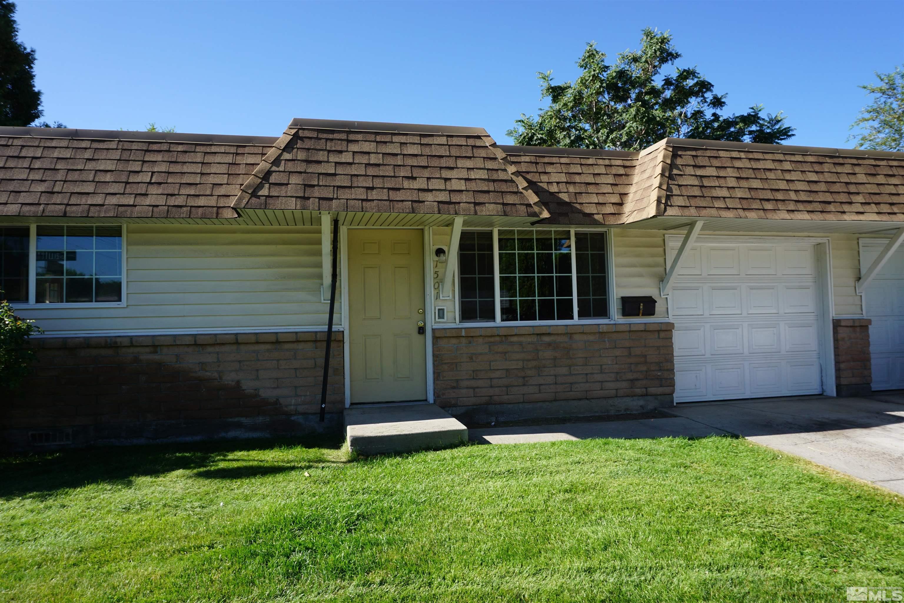 1501 Gault Way Sparks, NV 89431 - Photo 1 of 17 a front view of a house with garden