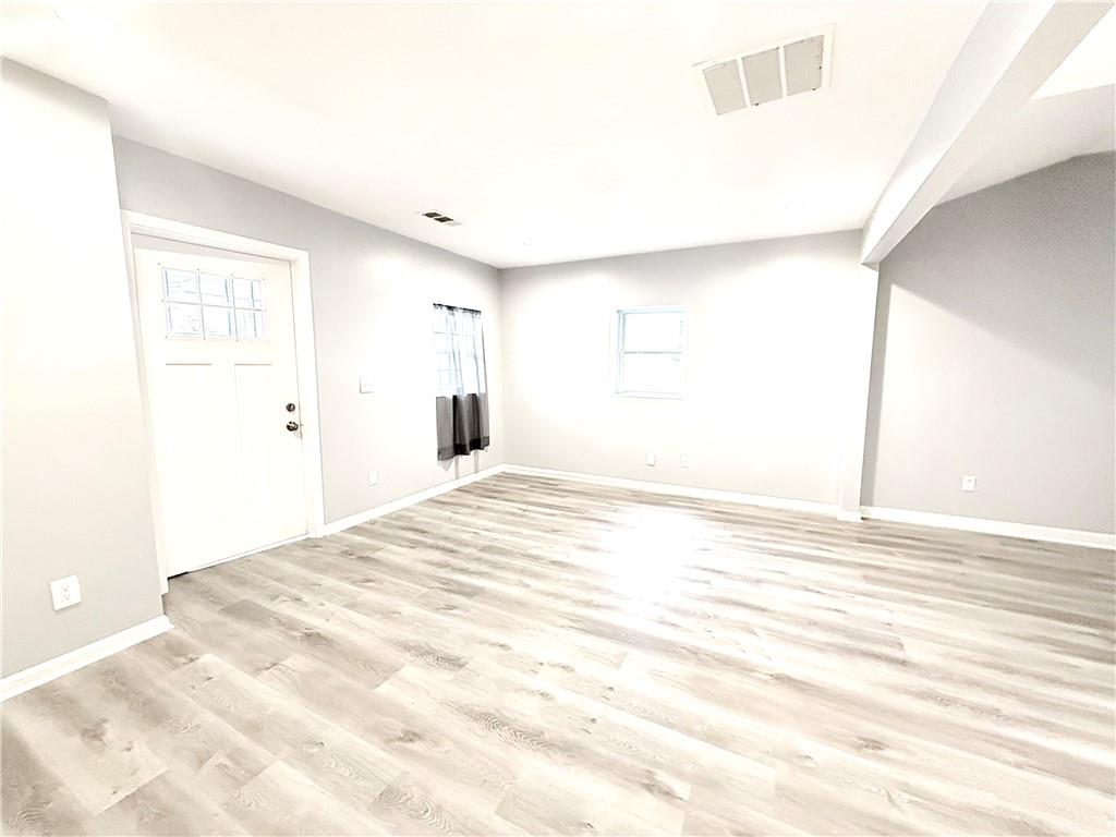 917 Garibaldi Street Southwest Atlanta, GA 30310 - Photo 5 of 9 a view of empty room with wooden floor