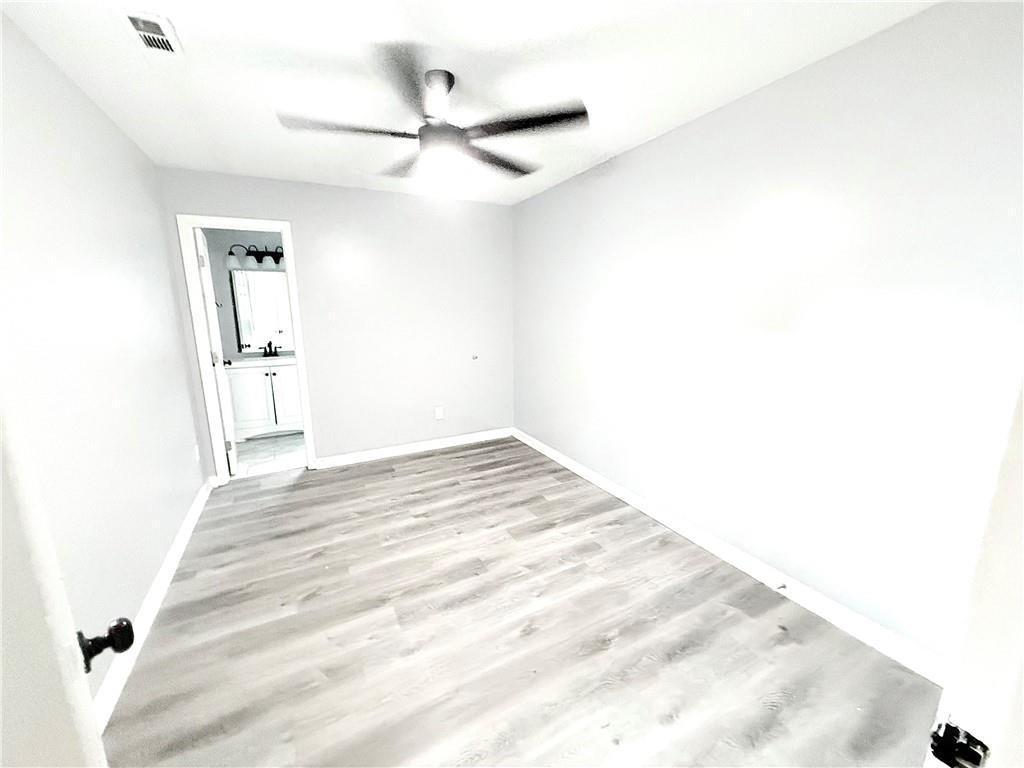 917 Garibaldi Street Southwest Atlanta, GA 30310 - Photo 6 of 9 a view of a room with wooden floor