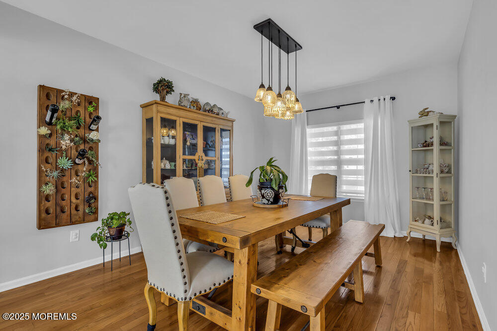 57 Gristmill Road Howell, NJ 07731 - Photo 23 of 80 a view of a dining room with furniture window and wooden floor