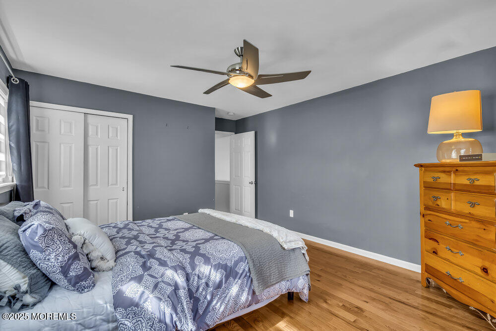 57 Gristmill Road Howell, NJ 07731 - Photo 53 of 80 a bedroom with a bed and wooden floor
