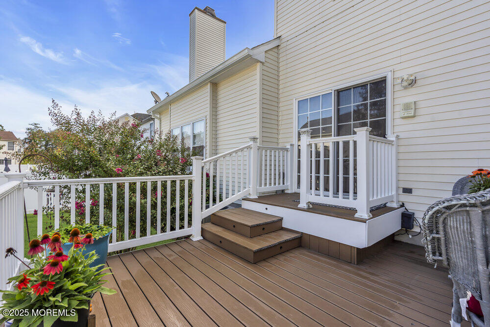 57 Gristmill Road Howell, NJ 07731 - Photo 77 of 80 a view of a deck with wooden floor and fence