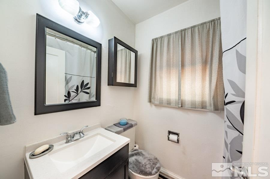 817 Gear Street Reno, NV 89503 - Photo 14 of 21 a bathroom with a sink and a mirror